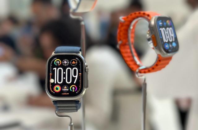 An Apple Watch Ultra 2 on a stand, with another one in the background. 