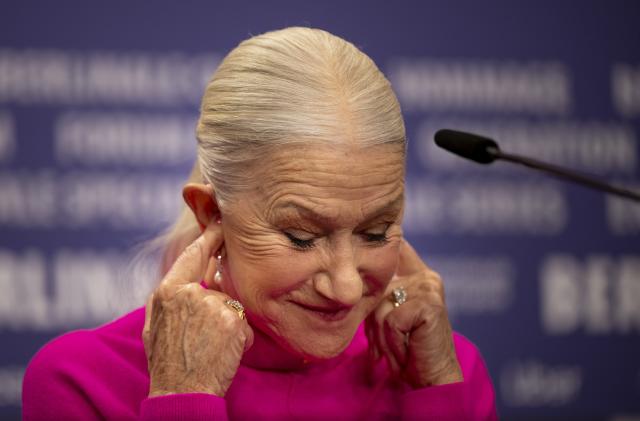 20 February 2023, Berlin: British actress Helen Mirren covers her ears at the press conference for the film "Golda". The film is screening in the Berlinale Special Gala section. The 73rd International Film Festival will take place in Berlin from Feb. 16-26, 2023. Photo: Monika Skolimowska/dpa (Photo by Monika Skolimowska/picture alliance via Getty Images)