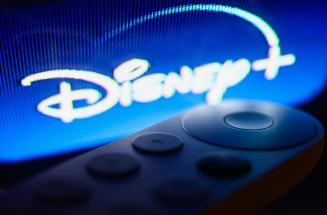 Disney+ logo on Chromecast menu displayed on a TV screen and Chromecast remote control are seen in this illustration photo taken in Krakow, Poland on July 19, 2023. (Photo by Jakub Porzycki/NurPhoto via Getty Images)