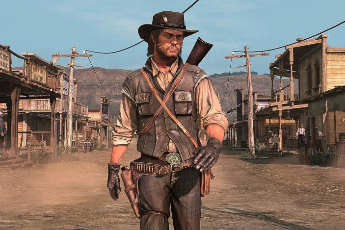 Screenshot from the original Red Dead Redemption (2010) ported onto the PS4. John Marston (protagonist) walks down a dusty road in the middle of an Old West town.