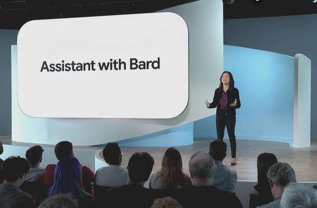 A Google presenter onstage with a slide reading "Google Assistant with Bard"