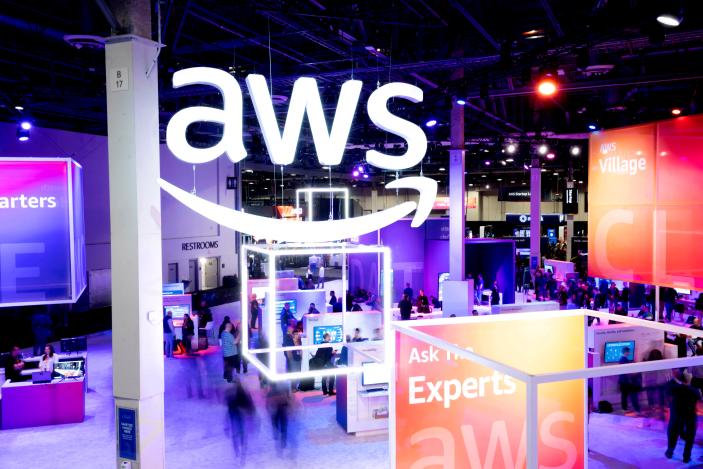Attendees walk through an expo hall at AWS re:Invent 2022, a conference hosted by Amazon Web Services (AWS), in Las Vegas, Nevada, U.S., November 30, 2022. Noah Berger/AWS/Handout via REUTERS THIS IMAGE HAS BEEN SUPPLIED BY A THIRD PARTY. MANDATORY CREDIT