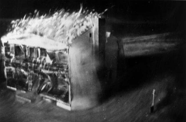 Atom bomb tests in Nevada. The destruction is photographed by a motion picture camera located 60 feet from the doomed house, which is encased in a two inch deep lead sheath.  It shoots 24 frames per second - the time from the first to the last picture (eight were taken) was only 2 1/3 seconds.  The only source of light was the atom bomb. Original Artwork: Image by Edgerton, Getrmeshausen and Grier Inc. for AEC.   (Photo by Keystone/Getty Images)