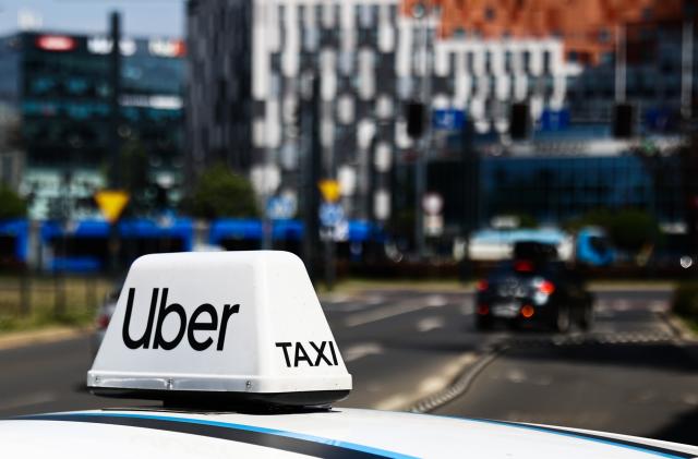 Uber sign is seen on a car in Krakow, Poland on July 4, 2023. (Photo by Jakub Porzycki/NurPhoto via Getty Images)