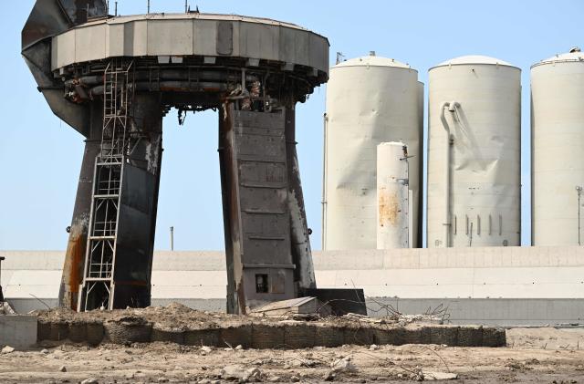 Debris litters the launch pad and dmaged tanks (R rear) on April 22, 2023, after the SpaceX Starship lifted off on April 20 for a flight test from Starbase in Boca Chica, Texas. - The rocket successfully blasted and the Starship capsule had been scheduled to separate from the first-stage rocket booster three minutes into the flight but separation failed to occur and the rocket blew up. (Photo by Patrick T. Fallon / AFP) (Photo by PATRICK T. FALLON/AFP via Getty Images)